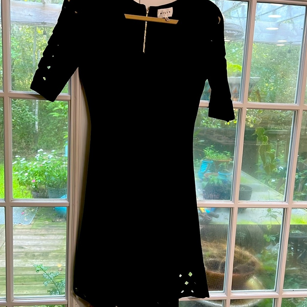 Milly black knit dress with cut out sleeves and hem.